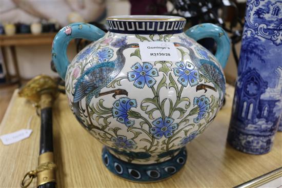 A modern Persian style two handled vase and a pair of blue and white sleeve vases